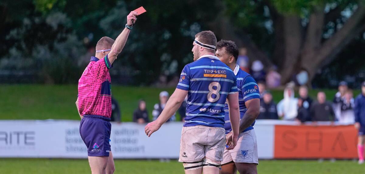 Referee Richard Parker issues a red card to Wanderers prop Willie Leoso, right. who is beside captain Piers Morell. Picture by Matt Mockovic