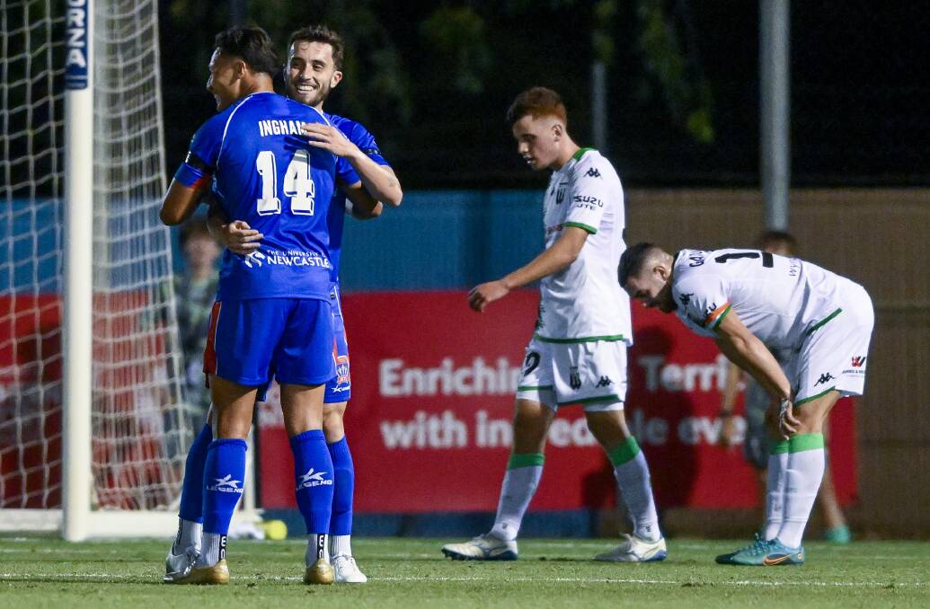 Dane Ingham congratulates Tom Aquilina after his first goal in a 4-1 win over Western United in Darwin on Wednesday night. Picture Getty Images