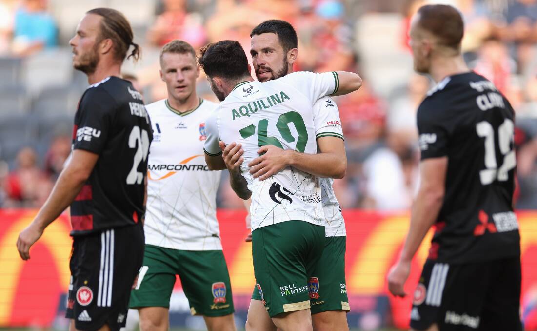 Stamatelopoulos is congratulated after scoring his second goal in the 3-all draw with Western Sydney at CommBank Stadium on Sunday. Picture Getty Images