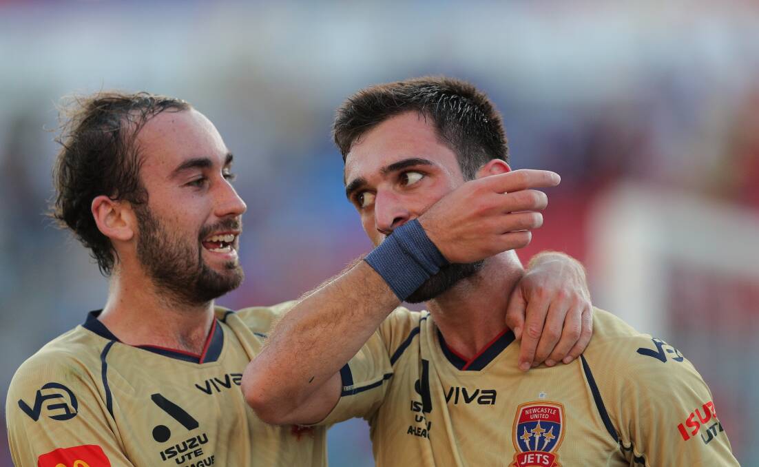 Newcastle Jets striker Beka Mikeltadze (right) with teammate Angus Thurgate. Picture by Max Mason-Hubers