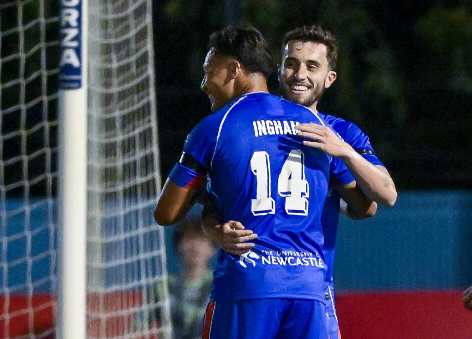 Dane Igham congratulates Tom Aquilina after the defender-turned-attacker scored the first of his two goals against Western United. Picture Getty Images