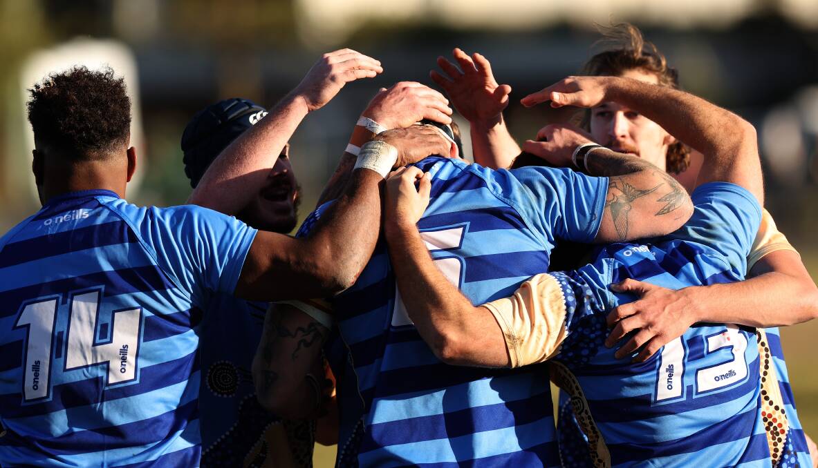Wanderers celebrate after Daniel Martine scored a try in the win over Merewether. Picture by Peter Lorimer