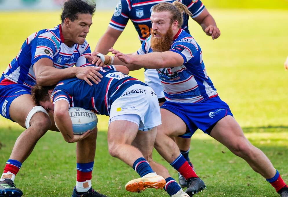 Donny Freeman (right) comes into help make a tackle in the Wildfires' 31-10 win over Easts. Picture by Stewart Hazell