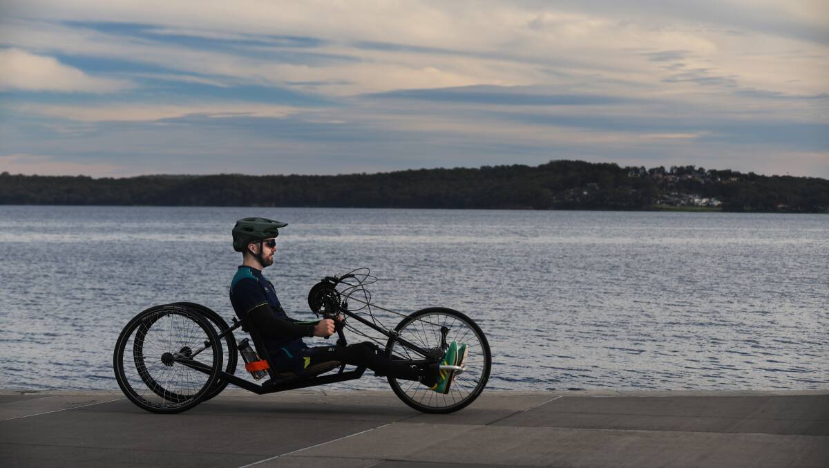 Paraplegic athlete Alex Hale at the Warners Bay foreshore. Picture by Simone De Peak
