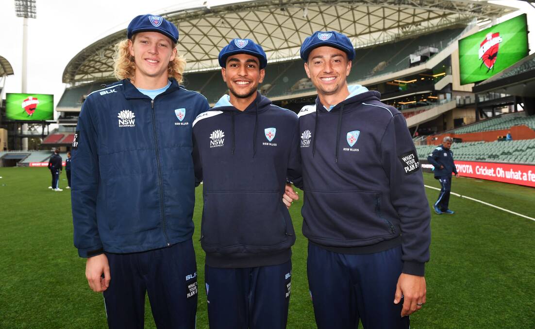 TRUE BLUE:  Newcastle batsman Jason Sangha (centre) flanked by fellow NSW debutants Jack Edwards and all-rounder Daniel Sams. Picture: Cricket NSW
