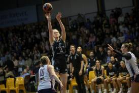 Lauren Jackson lets fly with a shot on the way to scoring 35 points for Albury in a big win over the Newcastle Falcons. Picture by James Wiltshere