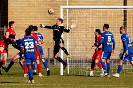 Newcastle OIympic keeper Adam Pearce at full stretch on Sunday. Picture by Peter Lorimer