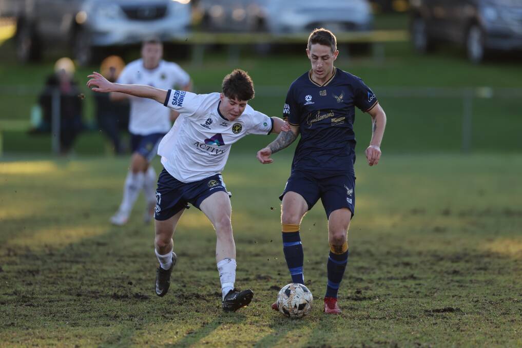 Lake Macquarie's Billy Thurlow and New Lambton's Riley Taylor battle on Saturday. Picture Sproule Sports Focus, NNSWF