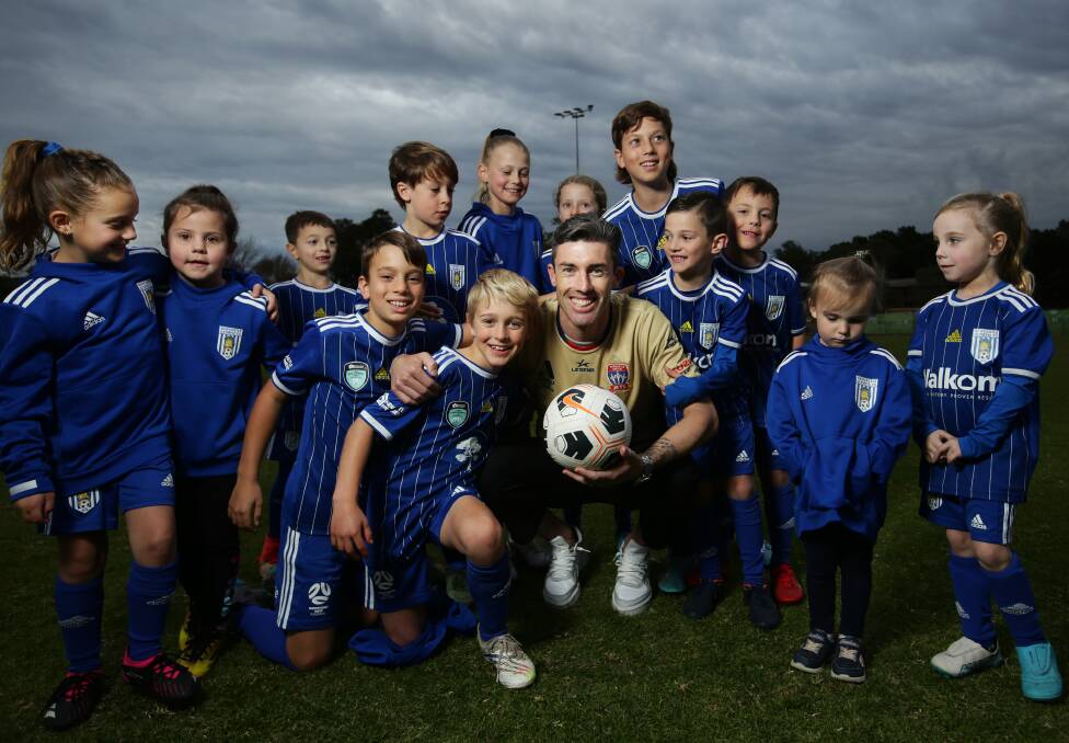 Jason Hoffman with Newcastle Olympic juniors last year after re-signing with the Jets. Picture by Simone De Peak 
