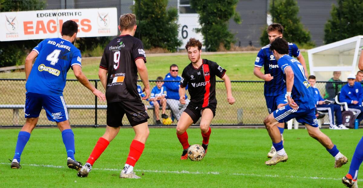 Seth Clark on the ball with Ryan Feutz ready for the pass against Newcastle Olympic. Picture Edgeworth Eagles