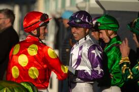 Local jockey Ash Morgan, centre, has a laugh between races at Tuesday's Newcastle meeting. Picture by Jonathan Carroll