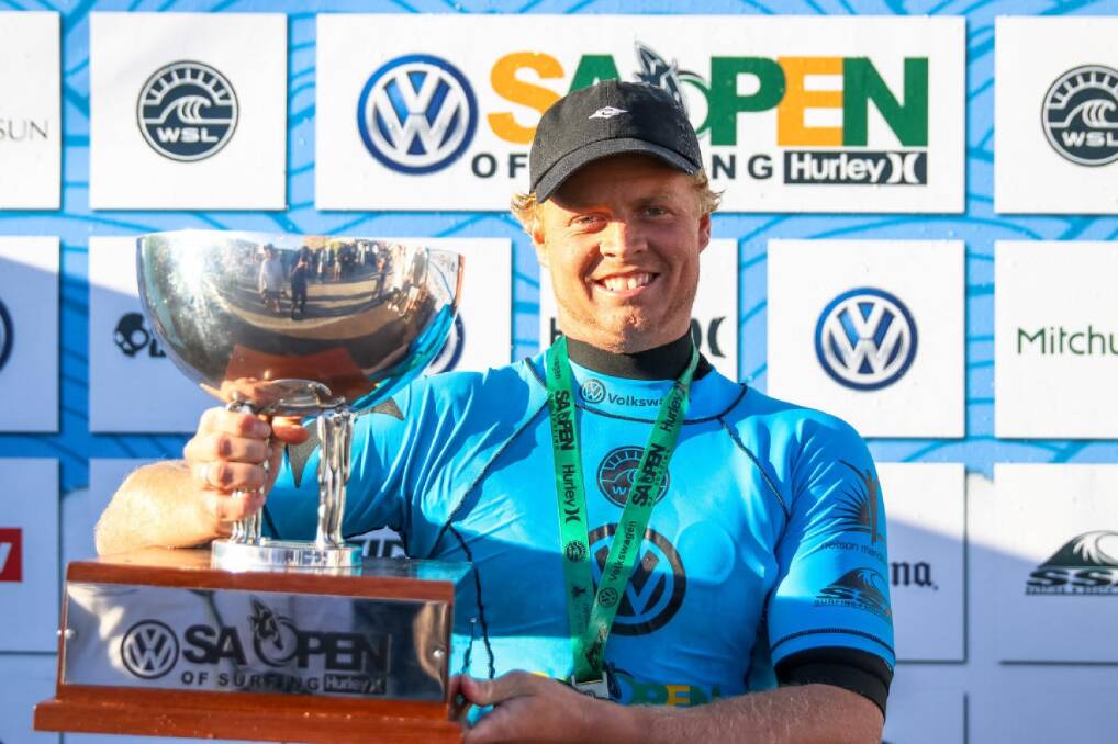 TROPHY HUNTER: Merewether surfer Jackson Baker with his third piece of WSL qualifying series silverware for 2018 after the SA Open of Surfing at Port Elizabeth. Picture: WSL/Ian Thurtell