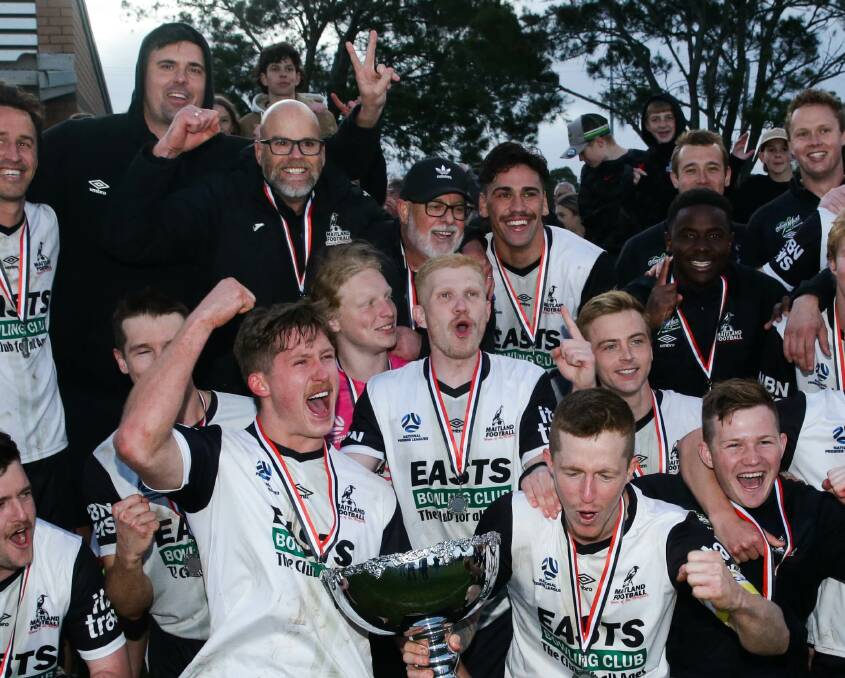 Coach Michael Bolch, centre with cap, during Maitland's premiership celebrations in 2022. Picture by Jonathan Carroll