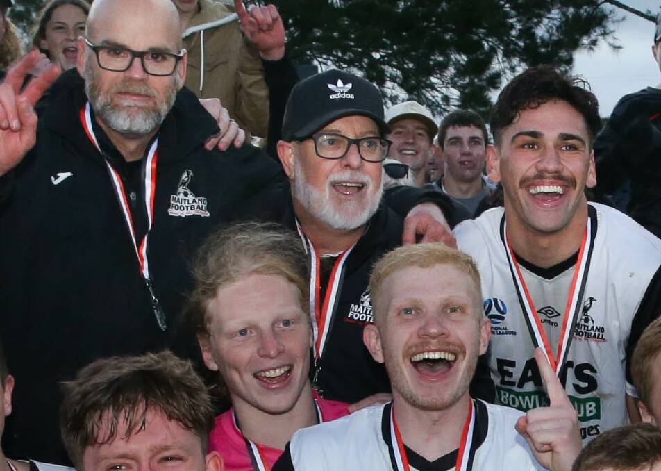 Michael Bolch, centre, enjoying the Magpies' premiership celebration. Picture by Jonathan Carroll