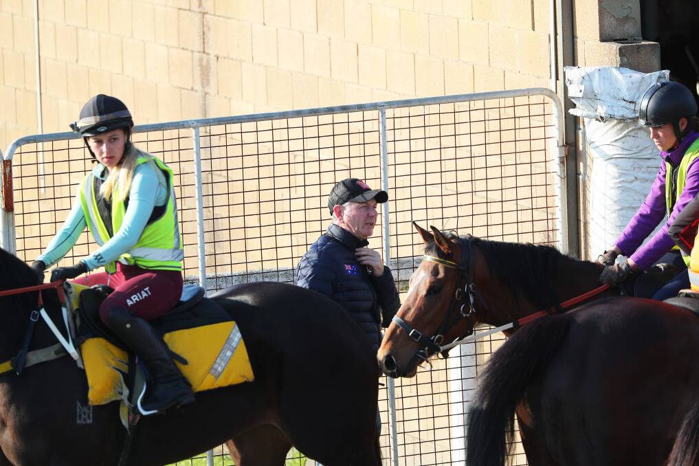 Kris Lees overseeing trackwork at Newcastle Racecourse on Monday. Picture by Peter Lorimer