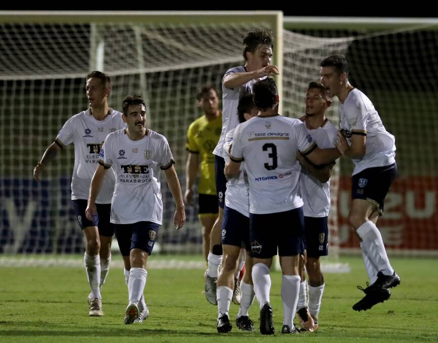 New Lambton celebrate their equaliser against Lambton Jaffas on Friday night at No.2 Sportsground. Picture by NNSWF/Sproule Sports Focus