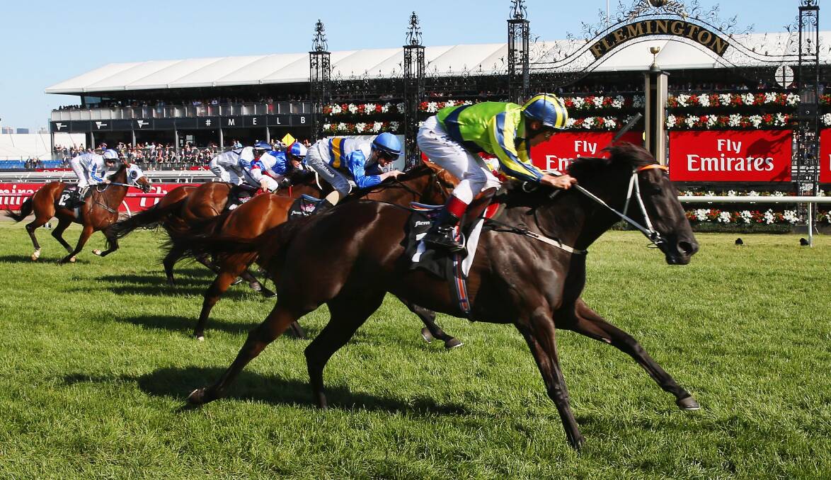 Damien Oliver rides Kris Lees-trained Lucia Valentina to victory in the Matriarch Stakes at Flemington in 2015. Oliver will wear the same colours when piloting Lees-prepared Kalapour on Saturday at the track in the Archer Stakes. Picture Getty Images
