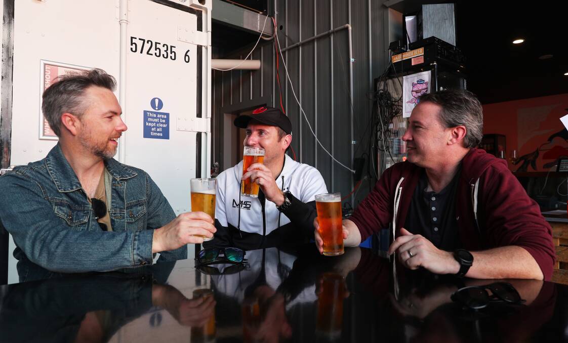 Newcastle Herald journalist Josh Leeson shares a beer at Shout with ale enthusiasts Robert Akers and Ryan Caldwell. Picture by Peter Lorimer