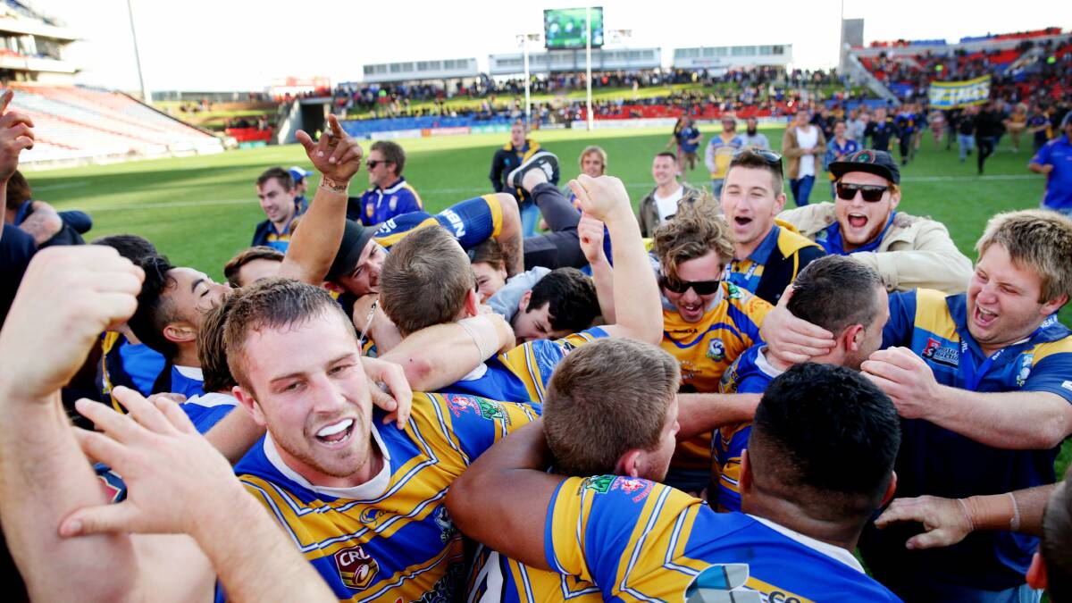 SWEET SUCCESS: Lakes celebrate their grand final victory over Macquarie at Hunter Stadium.