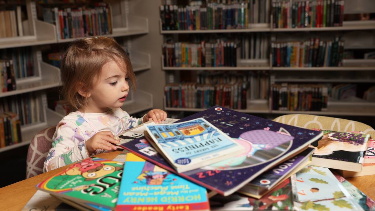 Saskia Bullock loves reading and the library's Rock n Rhyme. Picture by Peter Lorimer