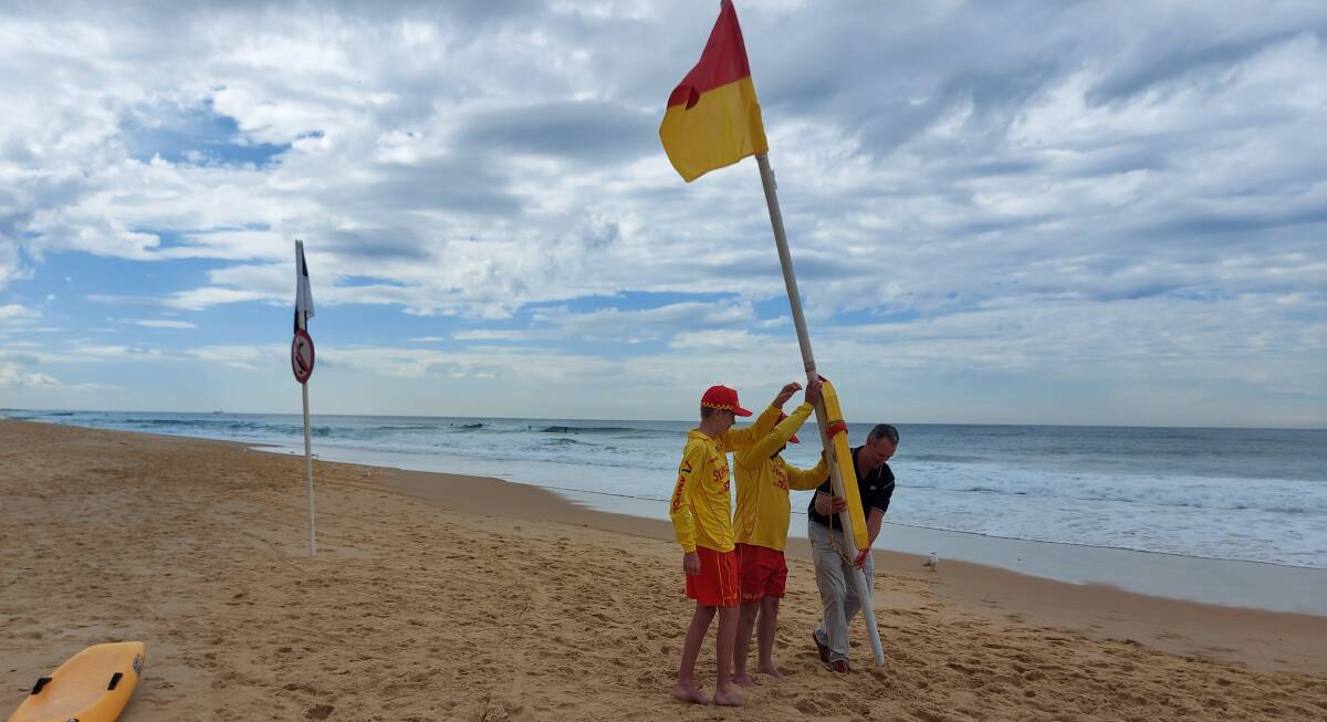 Hunter junior surf lifesaver of the year Taj Horadam, lifesaver of the year Brendon Ryman and Newcastle Permanent's Mark Colless. Picture supplied