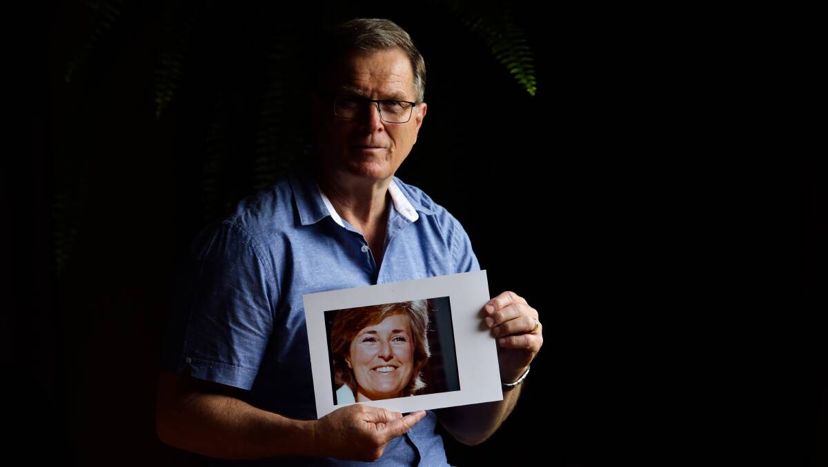 'You would never get a nicer person. She was soft spoken, just absolutely beautiful' ... Eleebana's Greg Simms with a picture of his sister Lynnette Dawson. Picture by Jonathan Carroll