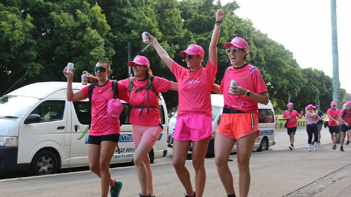 Jen Byles, Karen Maddison, Leanne Moss and Phoebe Sceresini, who have all battled breast cancer, cross the finish line of the Big Three Trek in Sydney. Pictures suppled