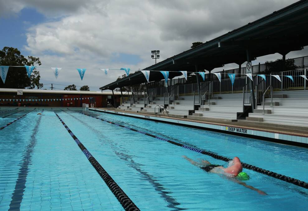 A swimmer churns out a lap at Lambton pool. Newcastle council will consider a subdivision application for the swim centre and Lambton Park. Picture by Simone De Peak