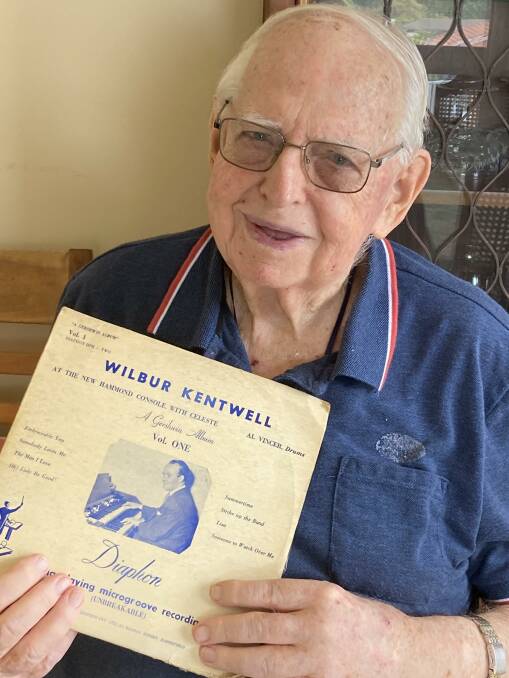 Newcastle identity John F. Miner at home with an LP record remembering
the era of Newcastle wartime entertainment. Picture by Mike Scanlon