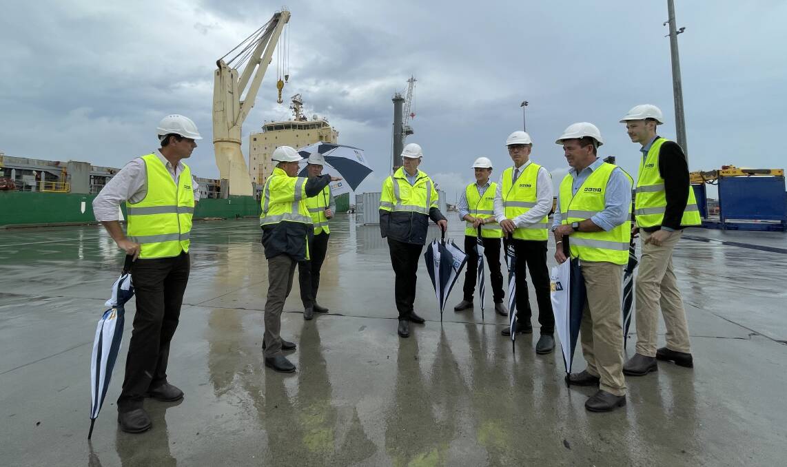 Paul Toole, second from right, tours the site of the proposed container terminal on Monday. Picture by Max Mason-Hubers