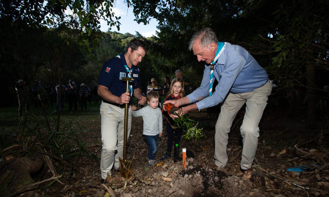 Antarctic explorer Dr Gareth Andrews, left, with his children, Arthur and Lucia, at the Glenrock tree planting with John Le Messurier. Picture by Jonathan Carroll