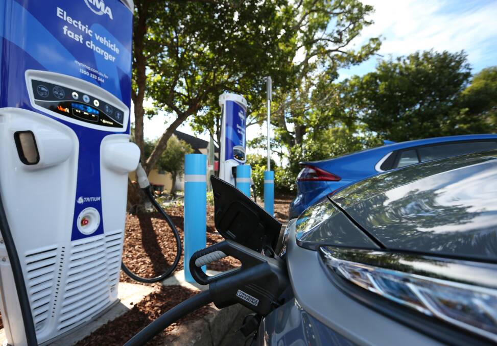 A car powers up at the NRMA's electric vehicle charging station in Wallsend. File picture 