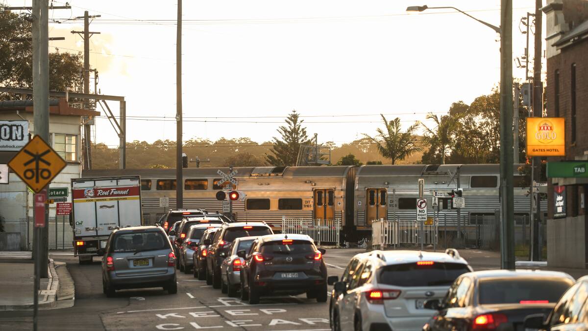 Traffic stopped at the Adamstown railway gates in 2019. Picture by Marina Neil