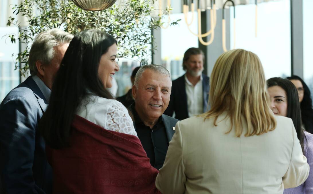 'HAPPY': Ghassan Aboud, wife Nahed and daughter Joud talk to lord mayor Nuatali Nelmes on the top floor of the Kingsley hotel on Monday. Picture: Simone De Peak 