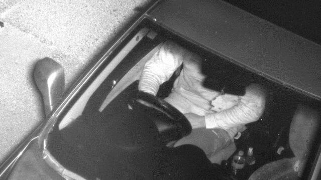A mobile phone camera captures an image of a driver not wearing a seatbelt. Image supplied