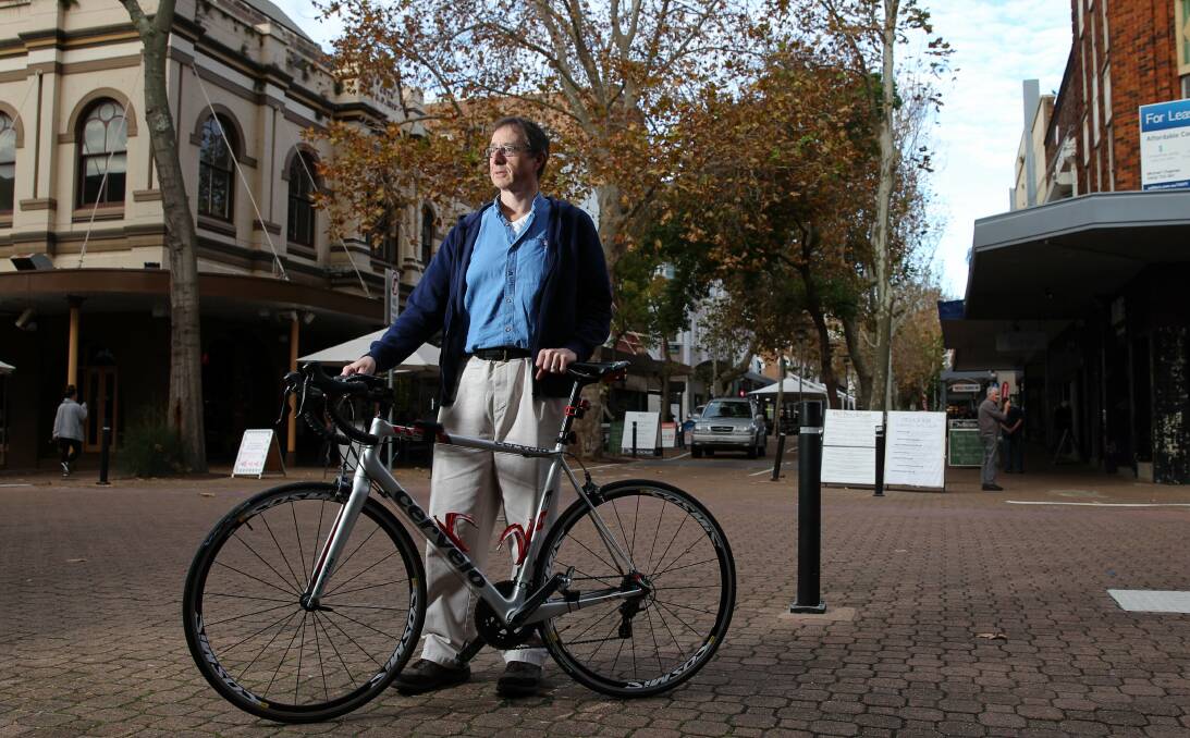Disappointed: Simon Potter of Fletcher is unhappy the well-used Jesmond Park cycleway will be cut to make way for the new section of the Newcastle Inner City Bypass. Picture: Max Mason-Hubers.