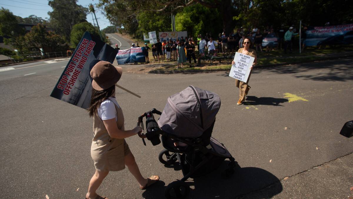A Port Stephens resident protesting last year. Picture by Jonathan Carroll.