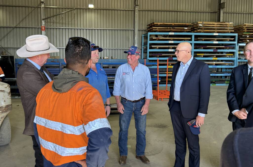 Peter Dutton and Barnaby Joyce meet with workers at Muswellbrook Steel Supplies on Tuesday. Picture by Matthew Kelly