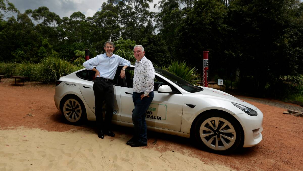 Paul Dastoor (left) and driver Stuart McBain back home at the University of Newcastle on Friday after completing the 15,000 km Charge Around Australia challenge. Picture by Jonathan Carroll