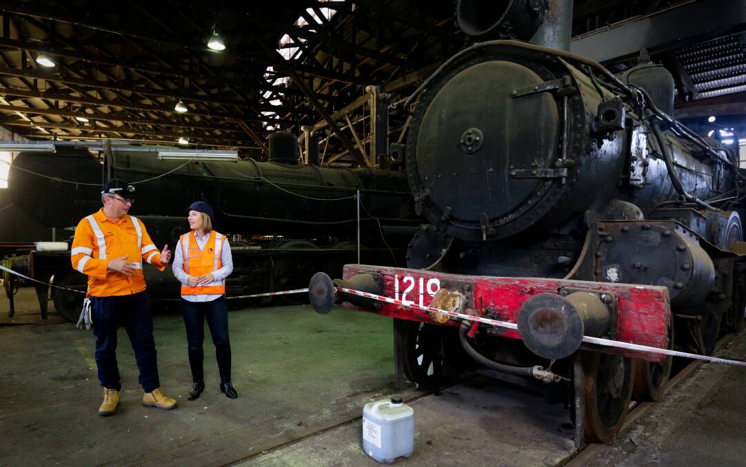 Transport Minister Jo Haylen and manager Ben ORegan inspect the heritage rail collection at Broadmeadow on Thursday. Picture by Jonathan Carroll