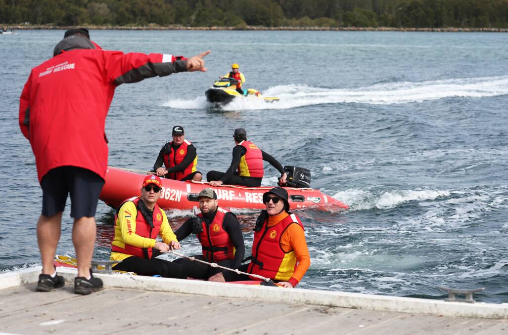 Surf Life Savers during the search on Sunday, July 7. Picture by Peter Lorimer