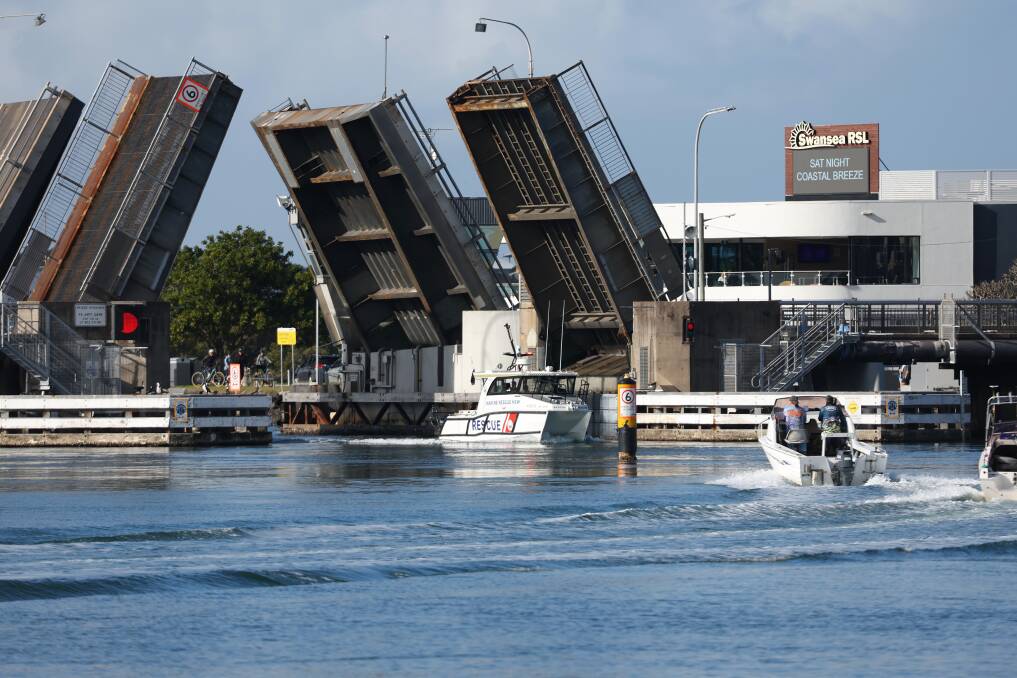 Rescue boats passing under the Swansea bridge on Sunday, July 7. Picture by Peter Lorimer