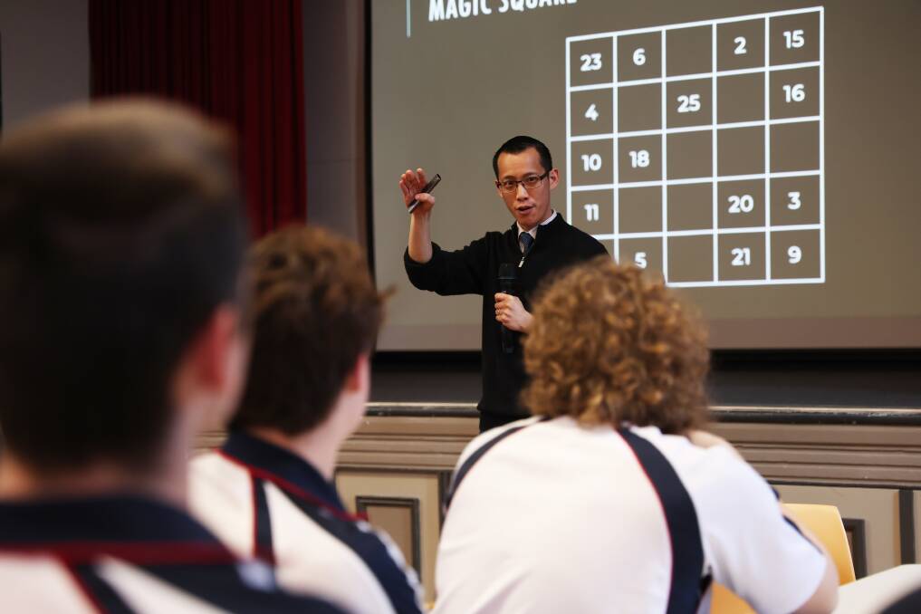 Eddie Woo explains the 'magic square' to Year 12 students at Newcastle High School on May 15. Picture by Peter Lorimer