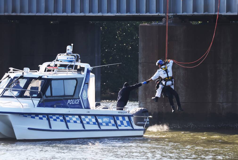 On the first day of action, a 67-year-old man was removed from Kooragang after marine and rescue police were called and an excavator was brought in. Picture by Peter Lorimer