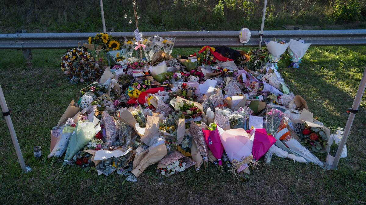Floral tributes at the crash scene in the aftermath of the tragedy. Picture by Marina Neil