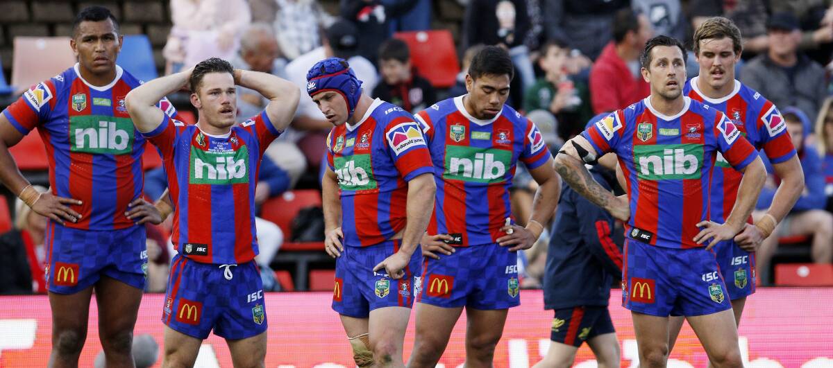 Dejected: The look on the faces of Knights players Daniel Saifiti, Tom Starling, Jamie Buhrer. Ken Sio, Mitchell Pearce and Cory Denniss says it all as Newcastle end the season with a disappointing 24-14 loss to the Dragons. Pictures: Darren Pateman/AAP