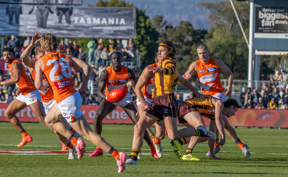 Hawthorn's Jack Ginnivan kicks while under pressure against Greater Western Sydney at UTAS Stadium this year. Both teams are still in finals contention. Picture by Paul Scambler 