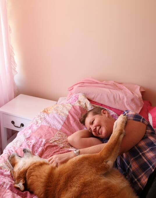 LIVING HER LIFE: Lily Hartley, pictured with her dog Booma, was robbed while overseas. Picture: Max Mason-Hubers.