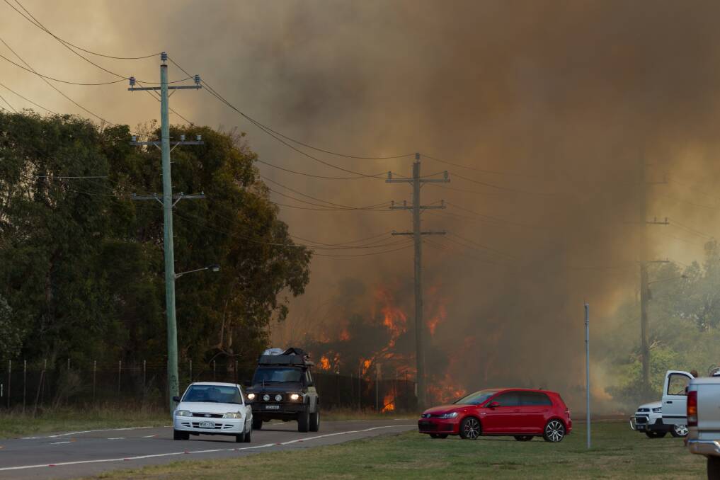 Hot: Authorities were called to the scene after members of the public called Triple Zero. A total fire ban was in place for the Hunter on Sunday. Picture: Max Mason-Hubers