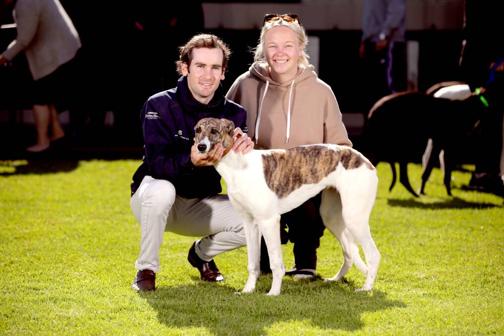 Group 1 winning jockey Tyler Schiller and his partner Alexandra Wilkinson with their new pup by Fernando Bale out of Yuko Girl. Photo Ross Schultz.